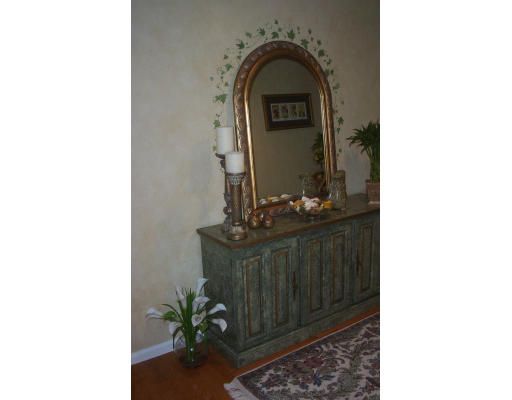 130 Mountain Gate Road, Unit 130 Ashland, MA 01721 - Photo 3 of 12 a living room with a sink and a mirror