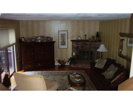 130 Mountain Gate Road, Unit 130 Ashland, MA 01721 - Photo 4 of 12 a black and white living room with furniture