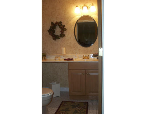 130 Mountain Gate Road, Unit 130 Ashland, MA 01721 - Photo 5 of 12 a bathroom with a sink and a mirror