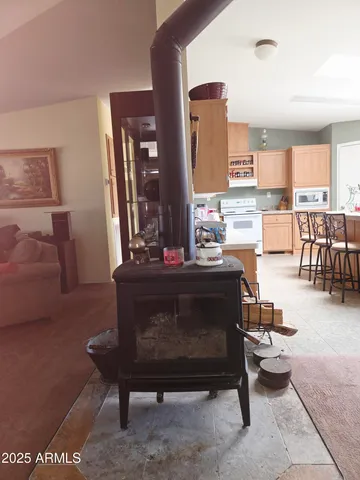 a living room with furniture a rug and a table