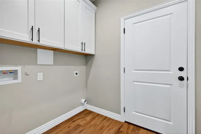 a kitchen with stainless steel appliances a stove sink microwave and cabinets