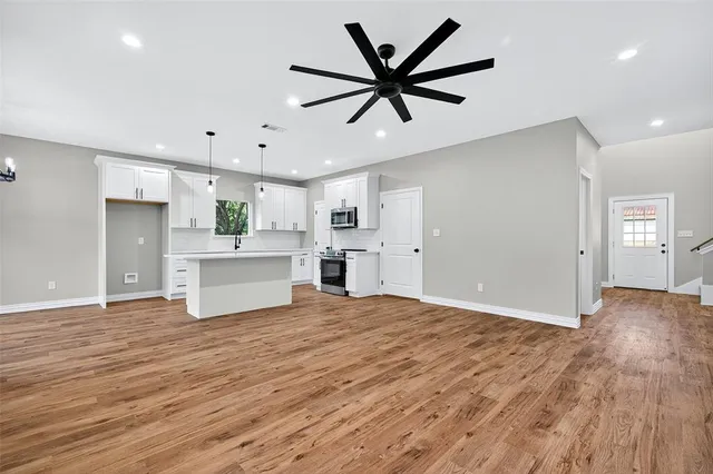 a view of a kitchen with a dishwasher and a refrigerator