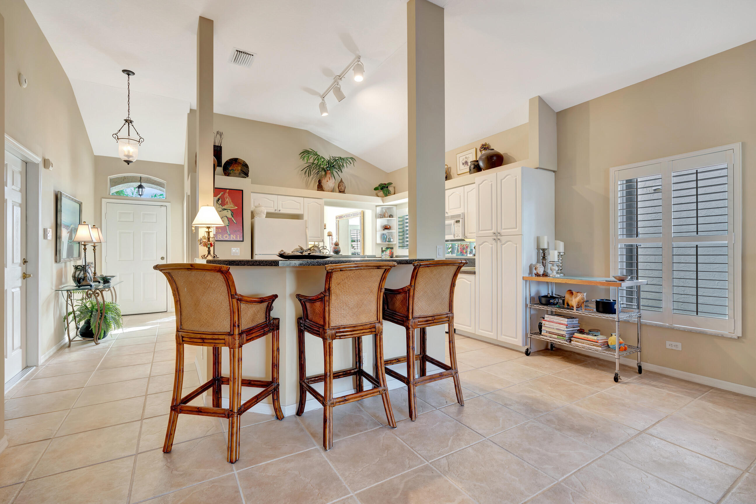 5018 Elpine Way Riviera Beach, FL 33418 - Photo 15 of 46 Bar seating in kitchen