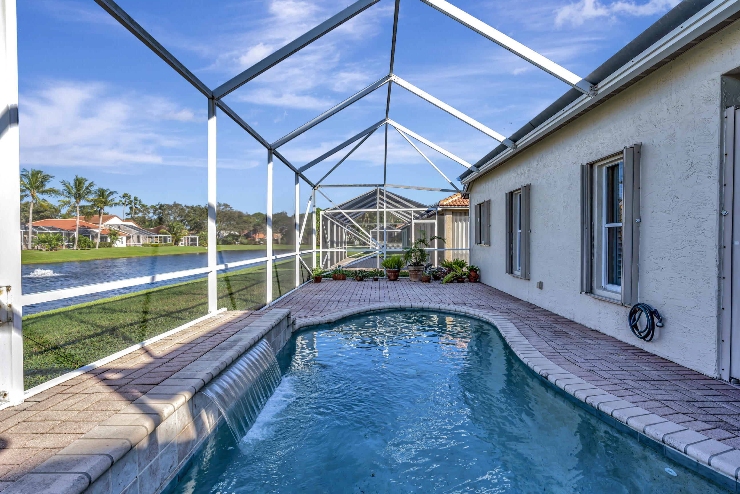5018 Elpine Way Riviera Beach, FL 33418 - Photo 33 of 46 Pool with waterfall