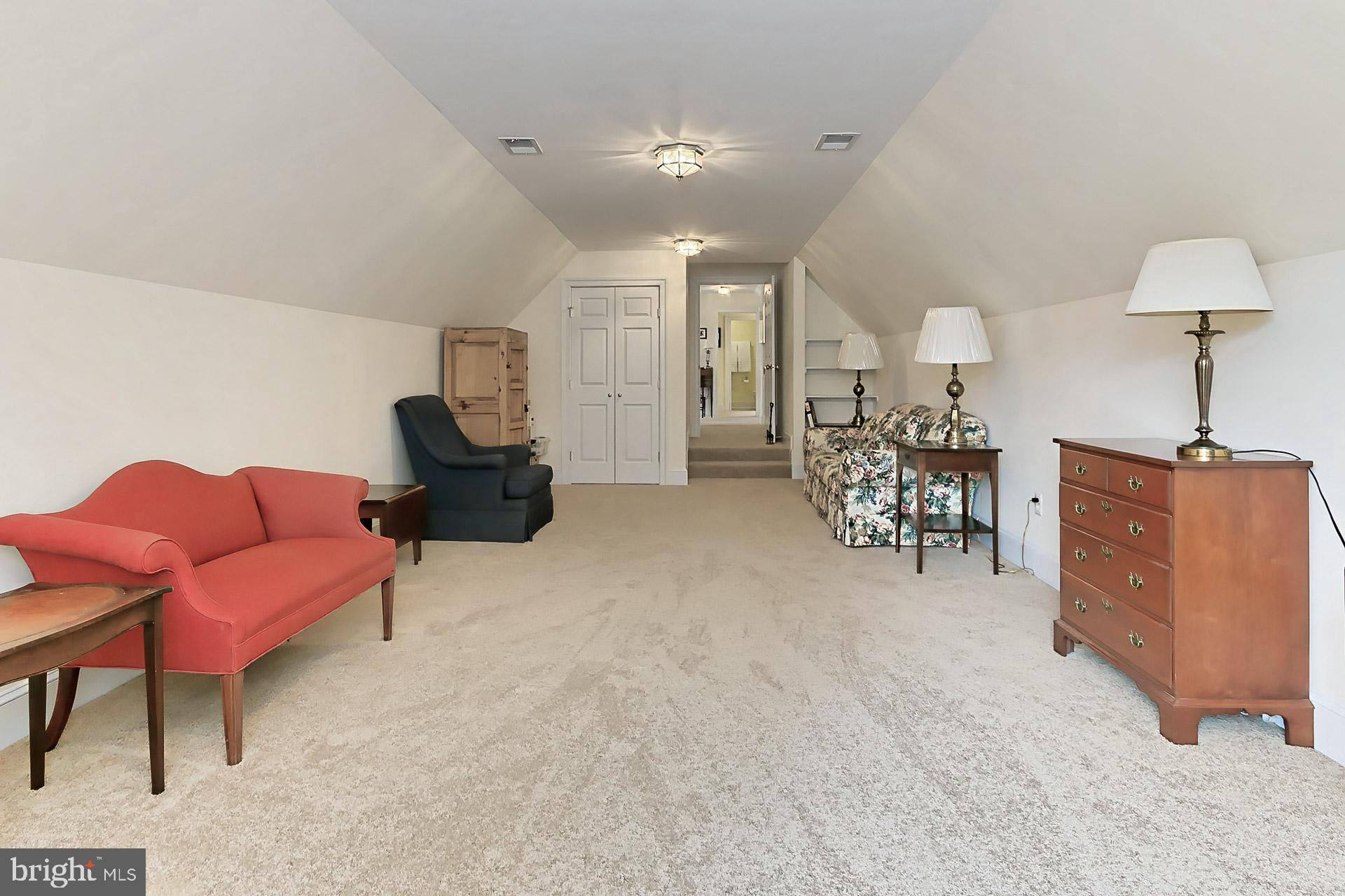 11208 West Montpelier Road Great Falls, VA 22066 - Photo 39 of 77 a living room with furniture and a chandelier