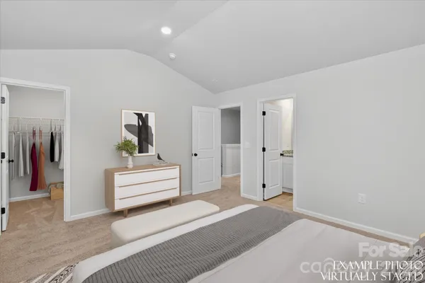 a view of hallway with stairs and wooden floor