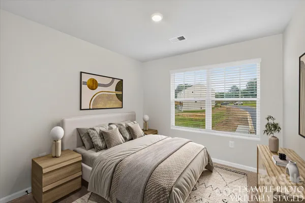 a bedroom with bed and a window