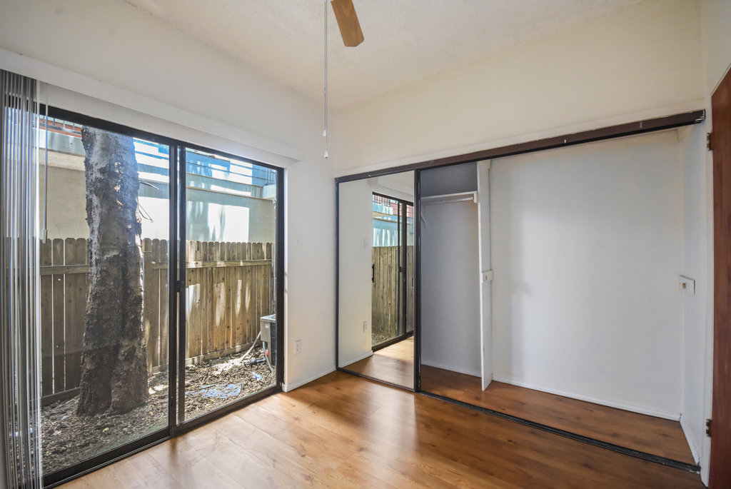 2815 Rio Grande Street, Unit 104 Austin, TX 78705 - Photo 19 of 22 a view of an empty room with wooden floor and a window