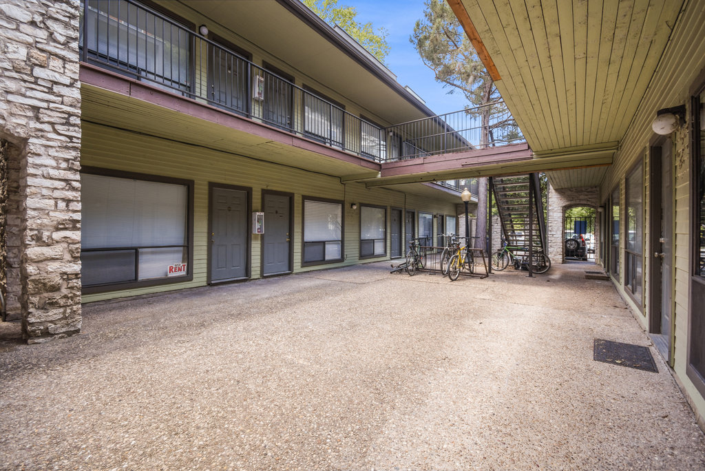 2815 Rio Grande Street, Unit 104 Austin, TX 78705 - Photo 6 of 22 a view of a building with a porch