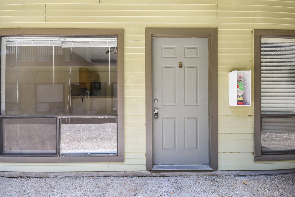 2815 Rio Grande Street, Unit 104 Austin, TX 78705 - Photo 7 of 22 a view of a wooden door