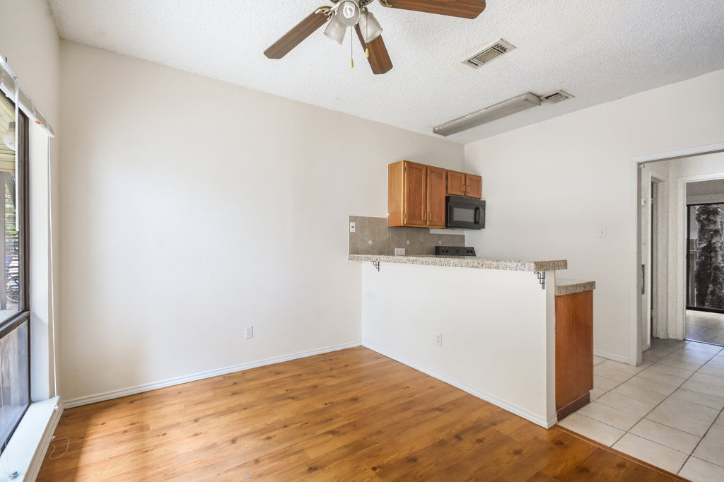 2815 Rio Grande Street, Unit 104 Austin, TX 78705 - Photo 8 of 22 a view of kitchen with microwave and cabinets