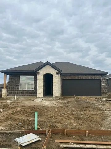 a front view of a house with yard