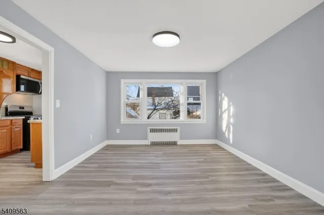 a view of outdoor space with wooden floor and fan