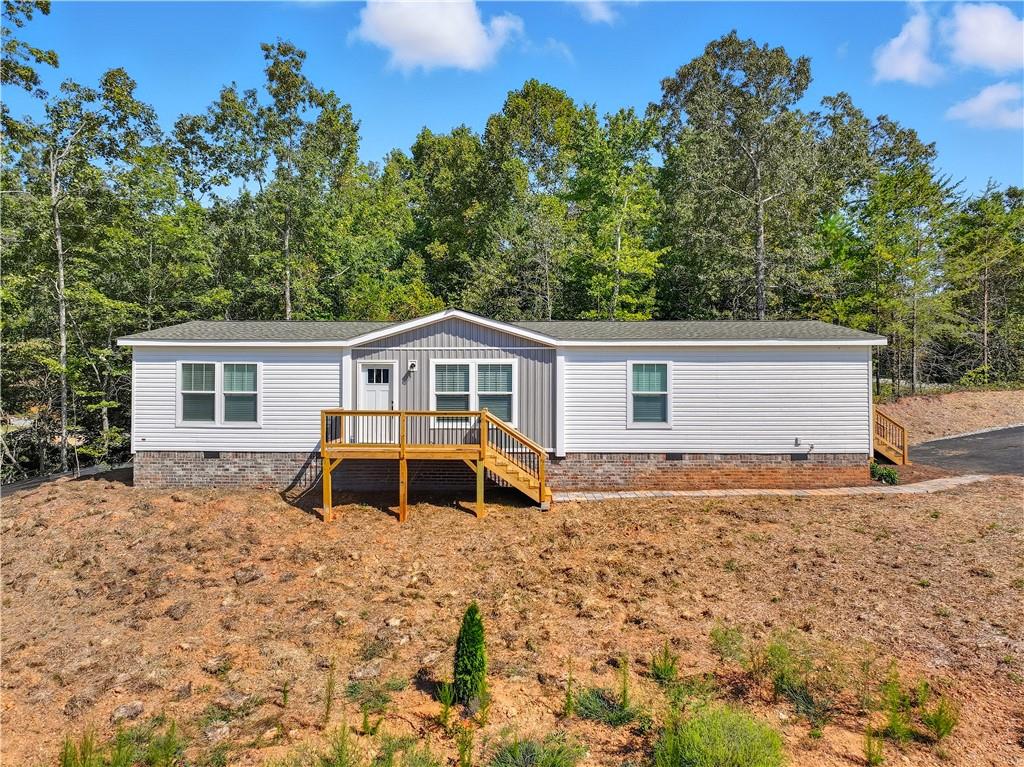 3246 Baker Road Gainesville, GA 30507 - Photo 1 of 1 a front view of a house with a yard