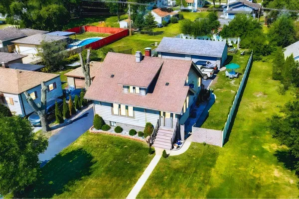 an aerial view of houses with swimming pool