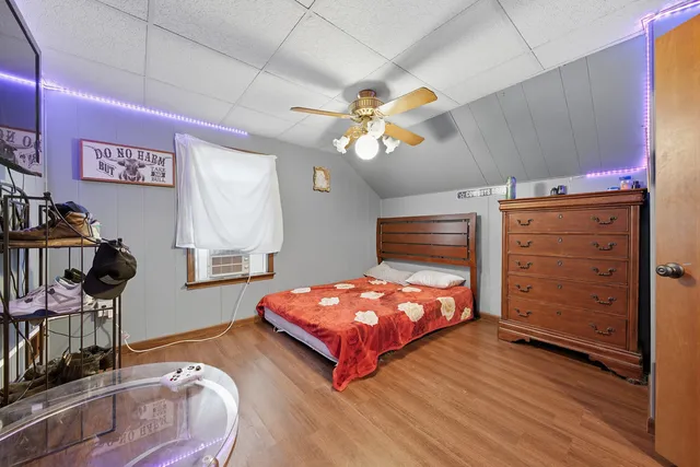 a bedroom with a bed and a tv in it