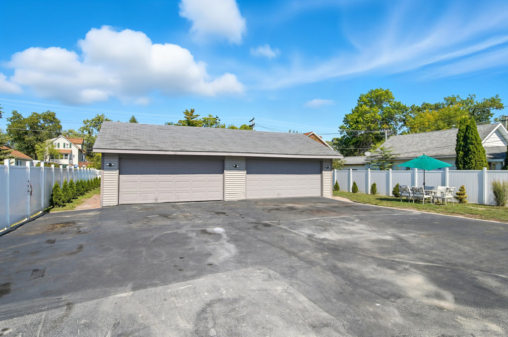 2616 Ridge Road Lansing, IL 60438 - Photo 20 of 25 a view of a house with a yard and garage