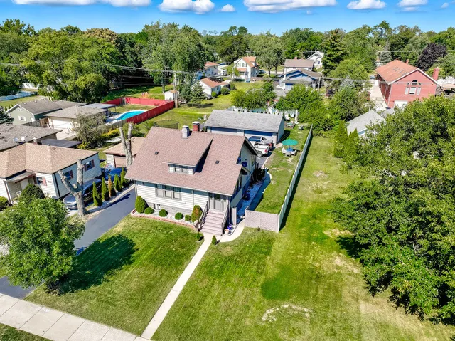 an aerial view of a house with a garden