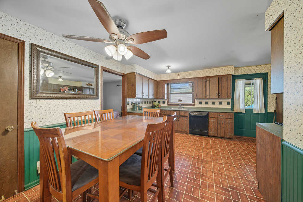 2616 Ridge Road Lansing, IL 60438 - Photo 5 of 25 a kitchen with stainless steel appliances granite countertop a stove a sink dishwasher and a refrigerator with wooden floor