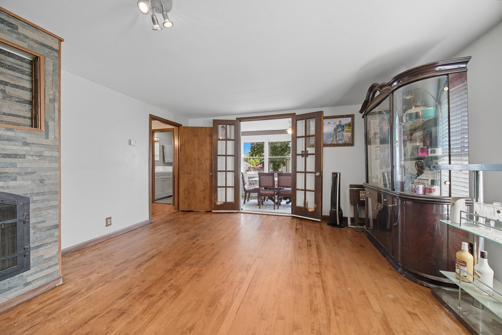 2616 Ridge Road Lansing, IL 60438 - Photo 7 of 25 an empty room with wooden floor and windows