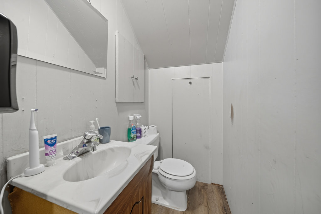 2616 Ridge Road Lansing, IL 60438 - Photo 9 of 25 a bathroom with a sink toilet and vanity