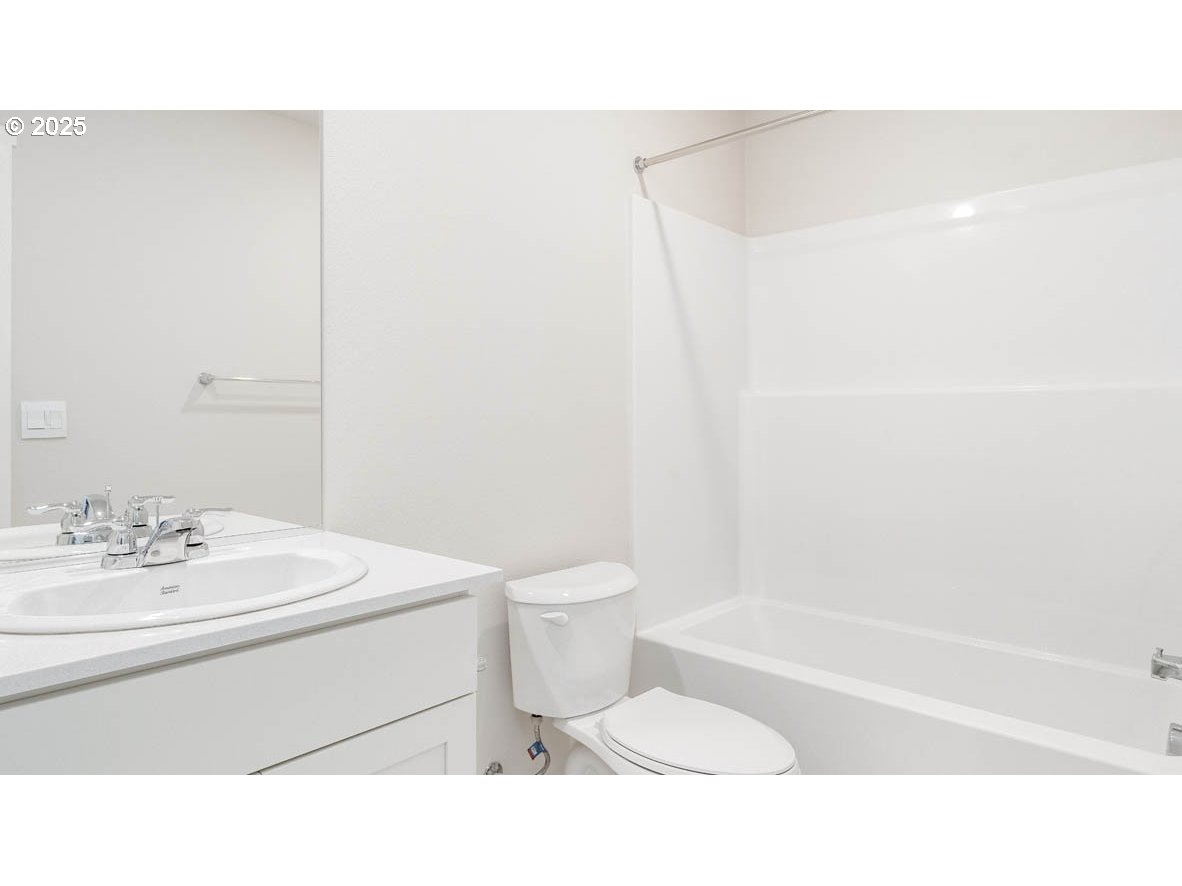 3671 Southwest 36th Street Gresham, OR 97080 - Photo 17 of 24 a bathroom with a sink a toilet and shower