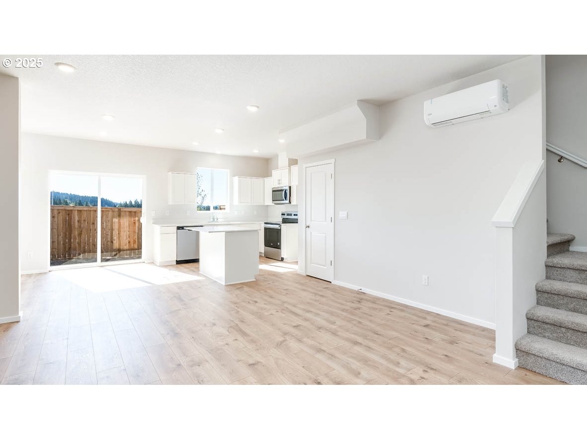 3671 Southwest 36th Street Gresham, OR 97080 - Photo 5 of 24 a open hall with kitchen island sink and refrigerator