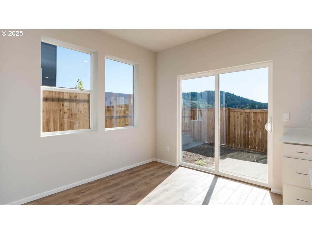 3671 Southwest 36th Street Gresham, OR 97080 - Photo 10 of 24 a room with a balcony and floor to ceiling windows