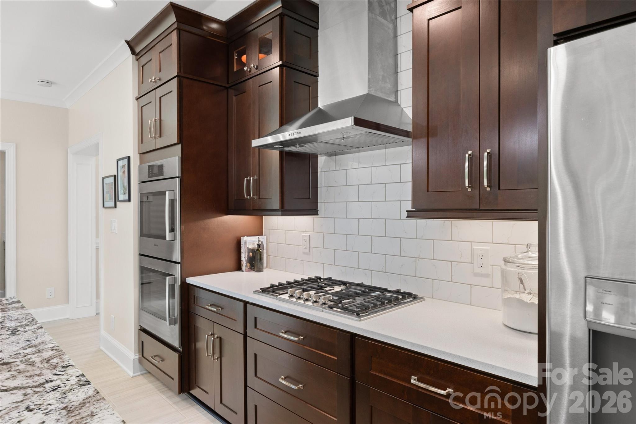 636 Landsdowne Court Fort Mill, SC 29708 - Photo 14 of 48 a kitchen with stainless steel appliances granite countertop a stove and a refrigerator