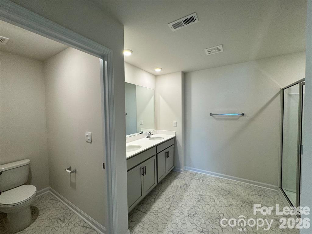 122 Old Home Road Statesville, NC 28677 - Photo 13 of 25 a bathroom with a sink and a toilet
