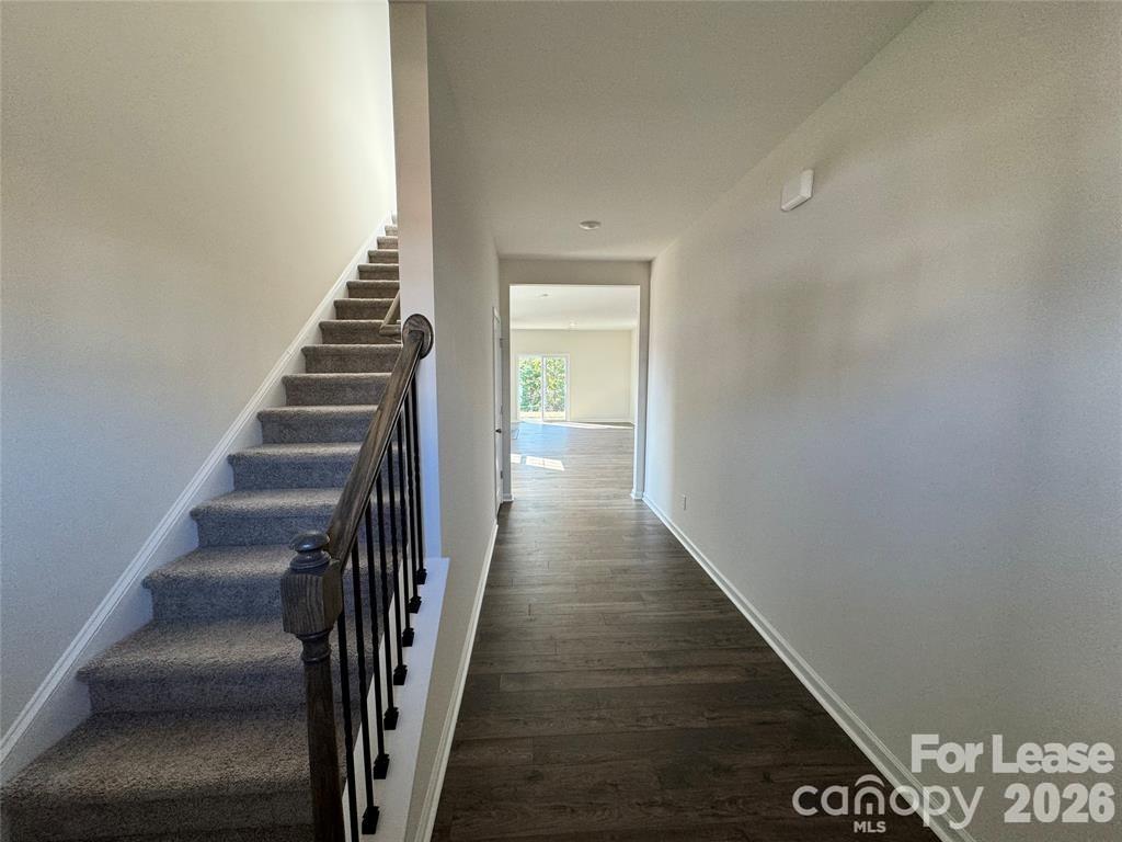 122 Old Home Road Statesville, NC 28677 - Photo 9 of 25 a view of a hallway with wooden floor and entryway