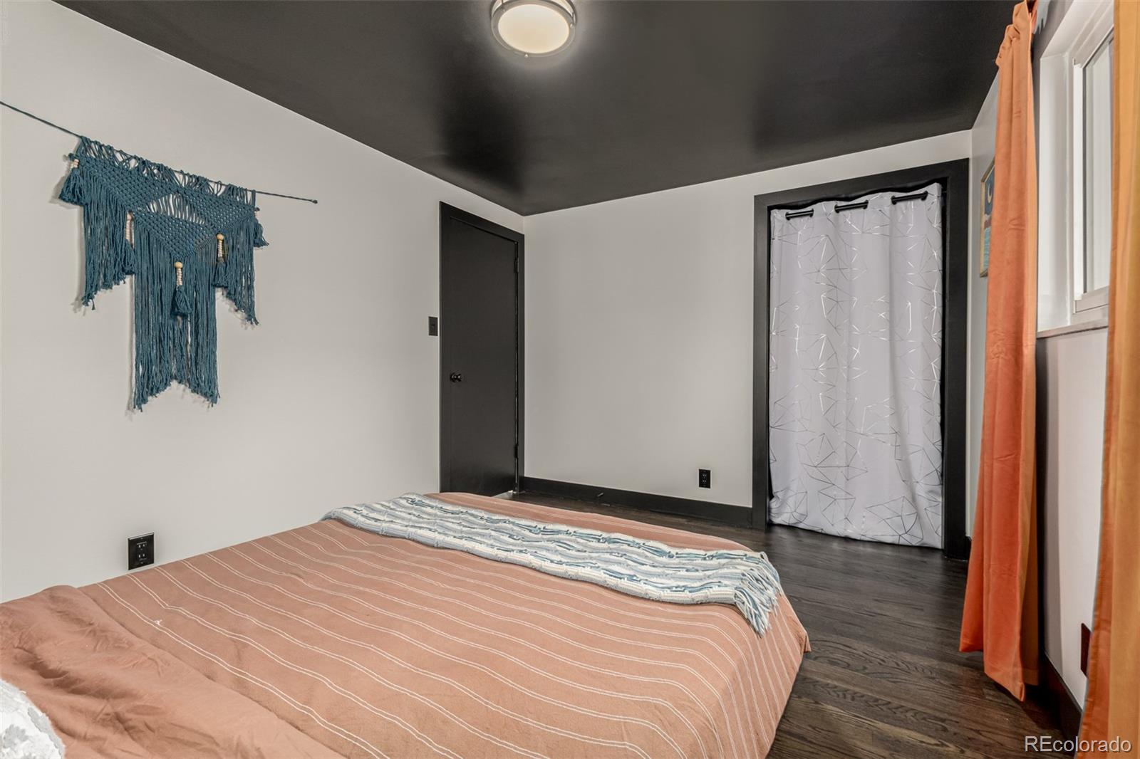 11875 Spring Drive Northglenn, CO 80233 - Photo 14 of 29 a bedroom with a bed and a window