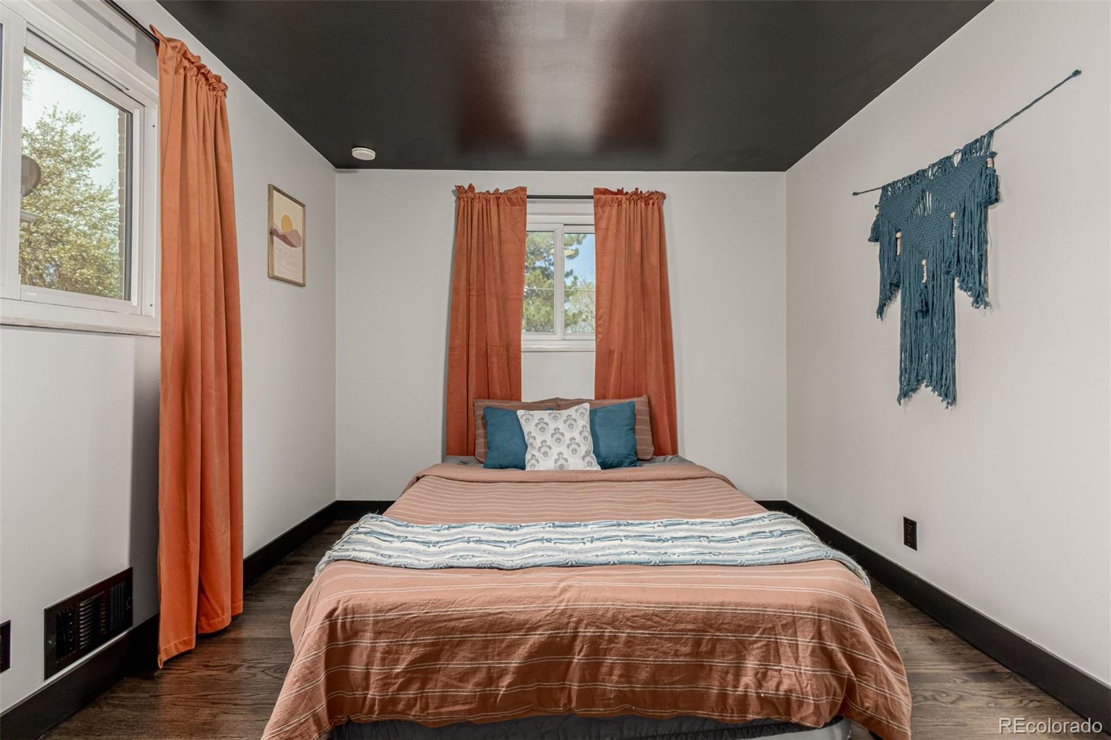11875 Spring Drive Northglenn, CO 80233 - Photo 15 of 29 a bedroom with a bed and a window