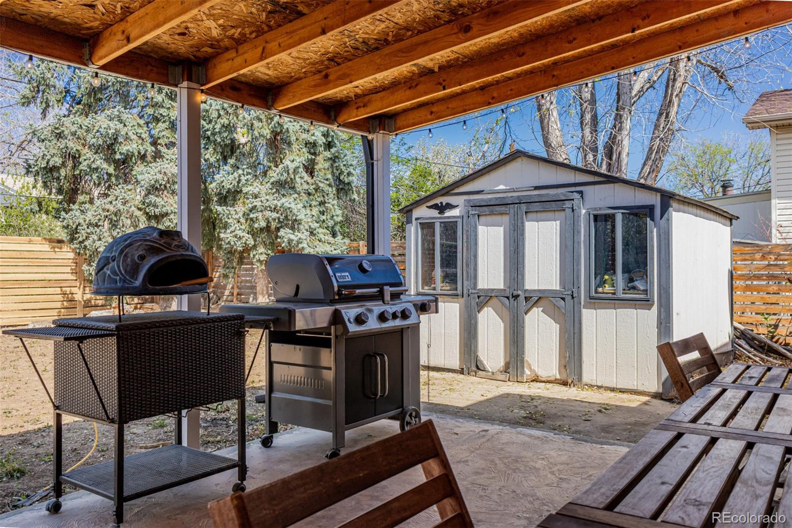 11875 Spring Drive Northglenn, CO 80233 - Photo 26 of 29 a front view of a house with outdoor seating