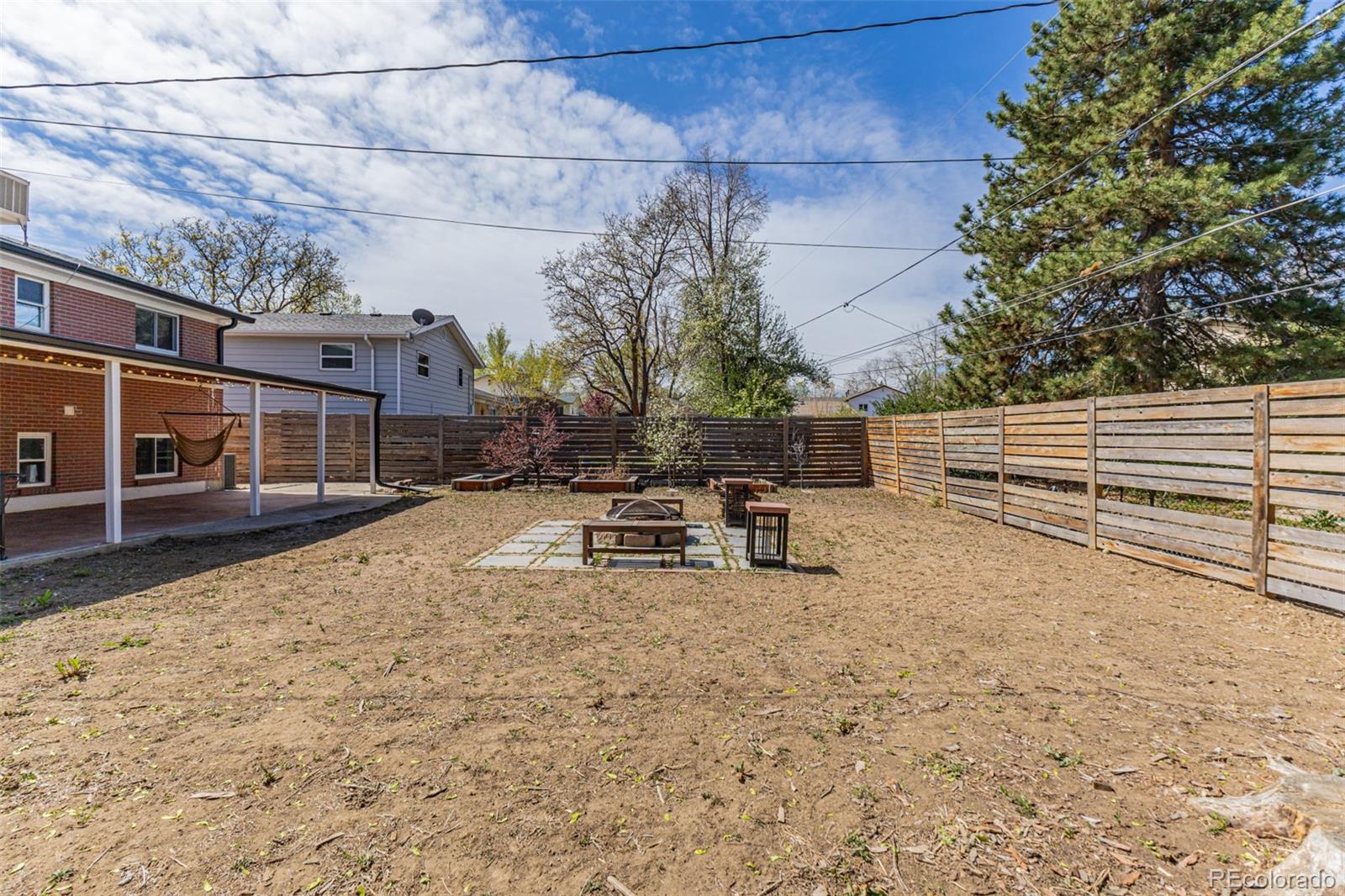 11875 Spring Drive Northglenn, CO 80233 - Photo 28 of 29 a view of a bench in the backyard