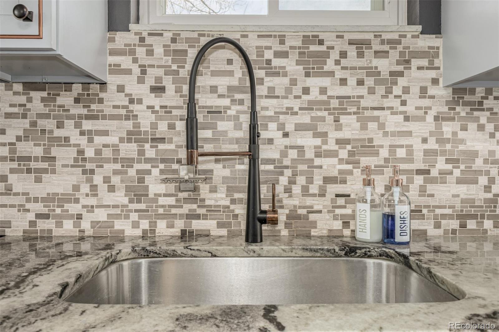 11875 Spring Drive Northglenn, CO 80233 - Photo 10 of 29 a close view of a sink and a mirror