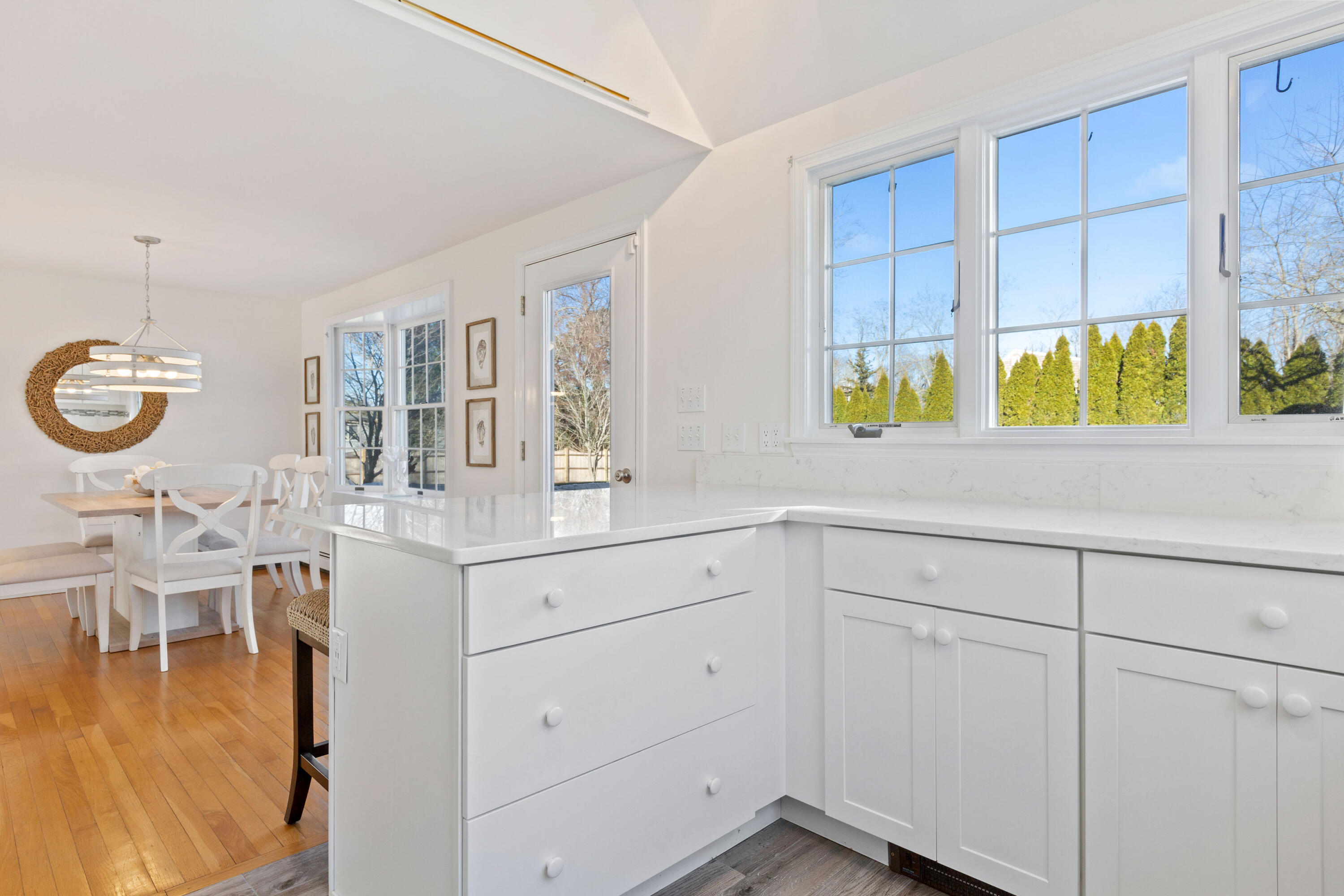 220 Hay Road Eastham, MA 02642 - Photo 15 of 54 a kitchen with a sink cabinets and window