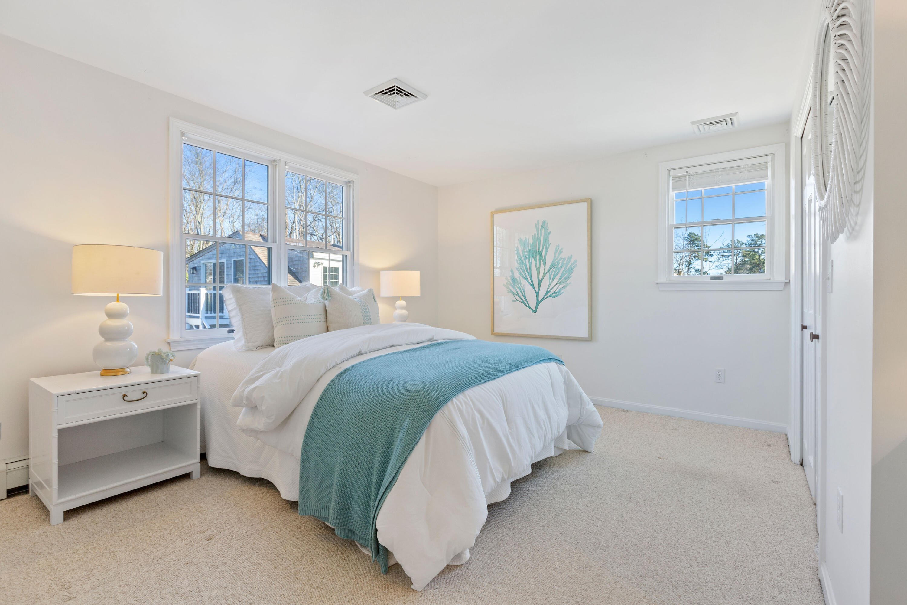 220 Hay Road Eastham, MA 02642 - Photo 32 of 54 a bedroom with a bed and a large window