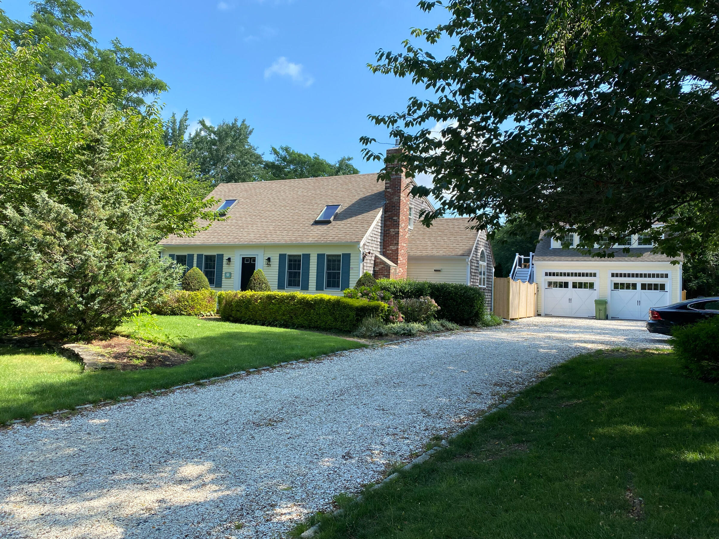 220 Hay Road Eastham, MA 02642 - Photo 5 of 54 a front view of a house with a yard and trees