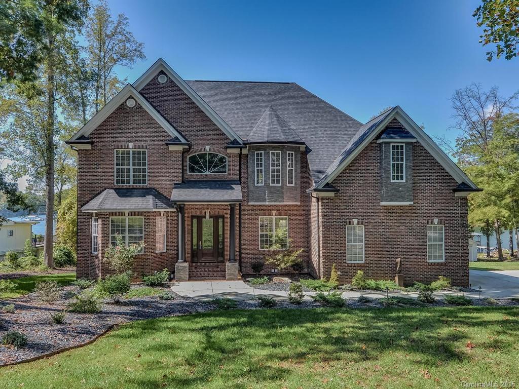 275 Whippoorwill Road Mooresville, NC 28117 - Photo 1 of 24 a front view of a house with a yard and garage