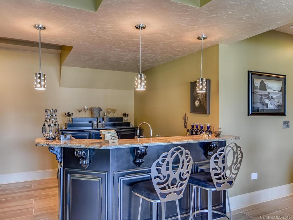 275 Whippoorwill Road Mooresville, NC 28117 - Photo 12 of 24 a dining room with furniture and wooden floor