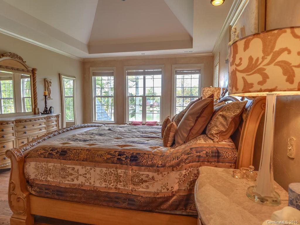 275 Whippoorwill Road Mooresville, NC 28117 - Photo 13 of 24 a bed sitting in a bedroom next to a window