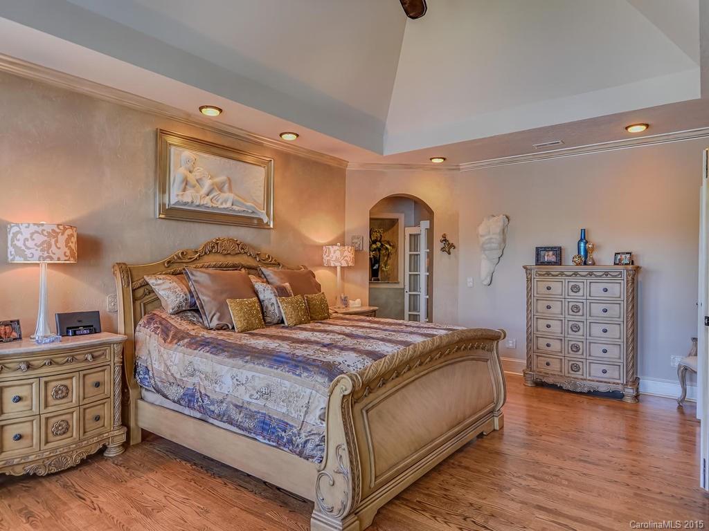 275 Whippoorwill Road Mooresville, NC 28117 - Photo 14 of 24 a bedroom with bed and wooden floor