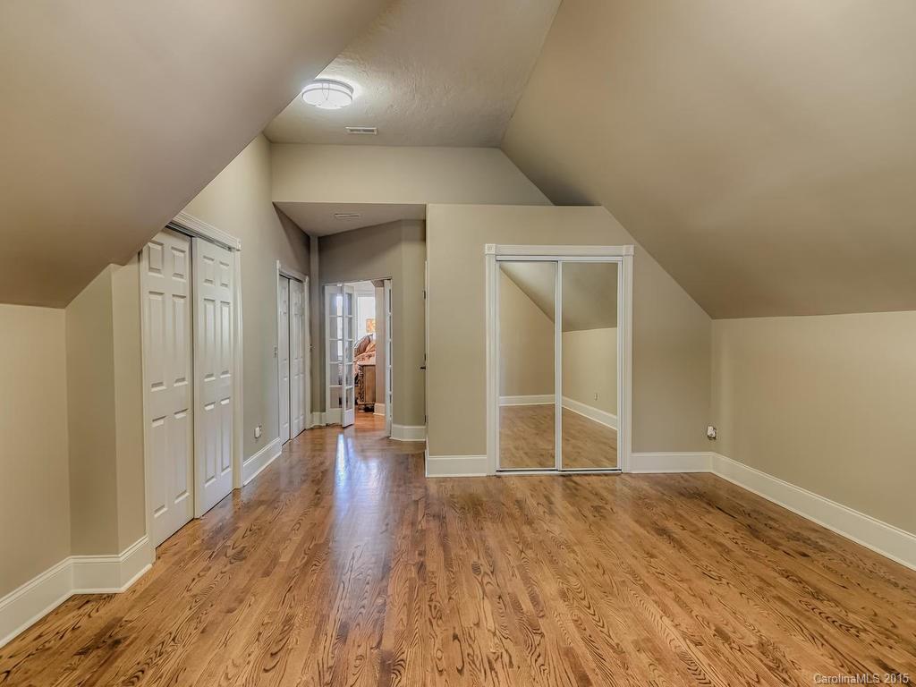 275 Whippoorwill Road Mooresville, NC 28117 - Photo 16 of 24 wooden floor in an empty room with a window