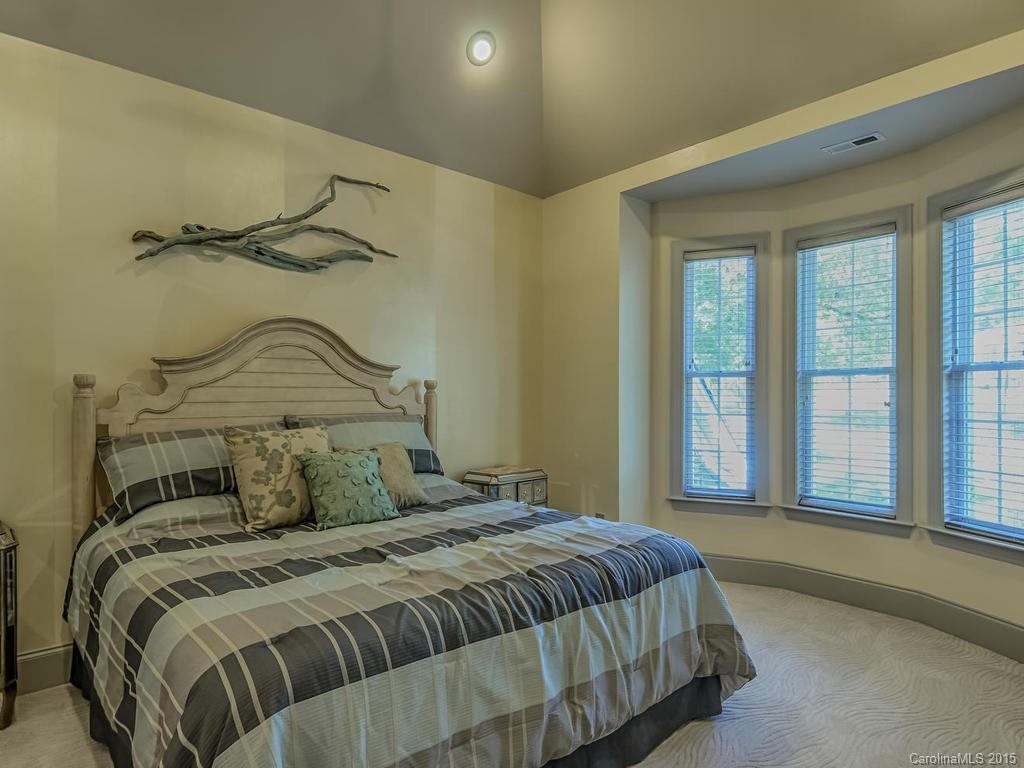 275 Whippoorwill Road Mooresville, NC 28117 - Photo 17 of 24 a bedroom with a bed and a window