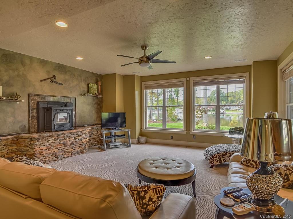 275 Whippoorwill Road Mooresville, NC 28117 - Photo 10 of 24 a living room with furniture and a fireplace