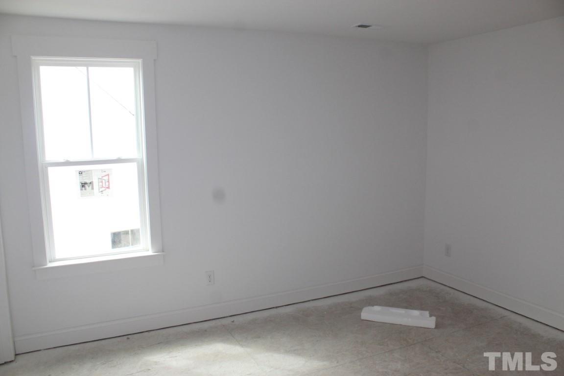 328 Prides Crossing Rolesville, NC 27571 - Photo 13 of 23 an empty room with a window