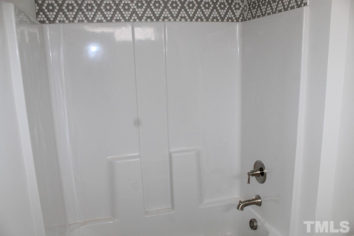 328 Prides Crossing Rolesville, NC 27571 - Photo 15 of 23 a bathroom with a shower