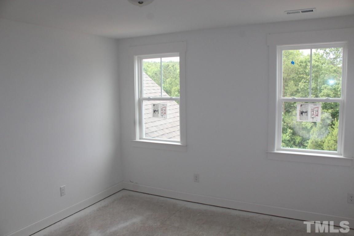 328 Prides Crossing Rolesville, NC 27571 - Photo 16 of 23 an empty room with windows