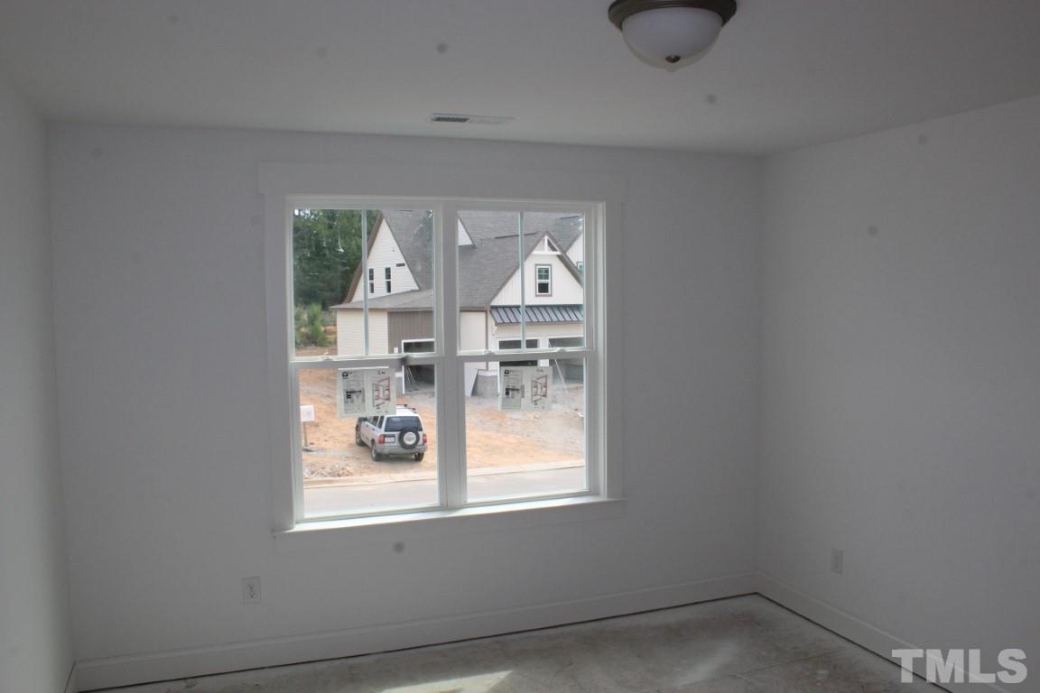 328 Prides Crossing Rolesville, NC 27571 - Photo 17 of 23 an empty room with window